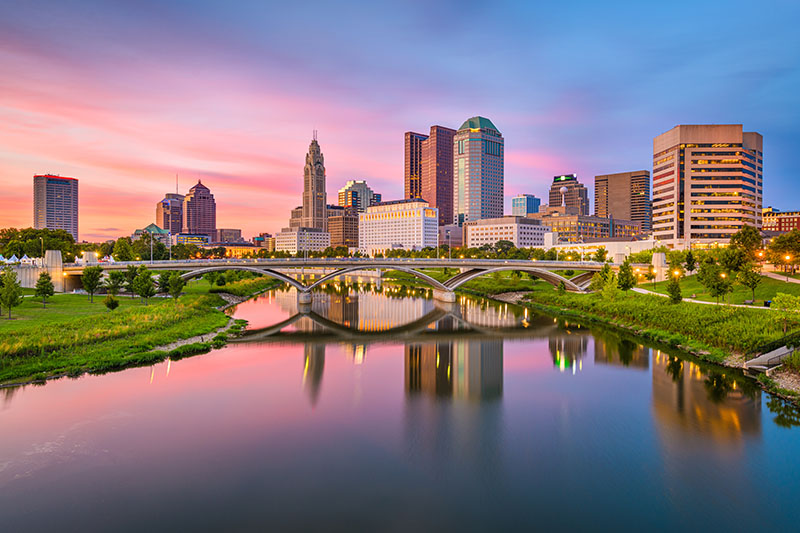 Columbus, Ohio, USA skyline on the river at dusk.