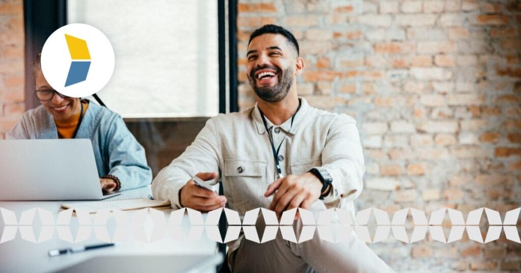 smiling relaxed business man sitting at a table with partner