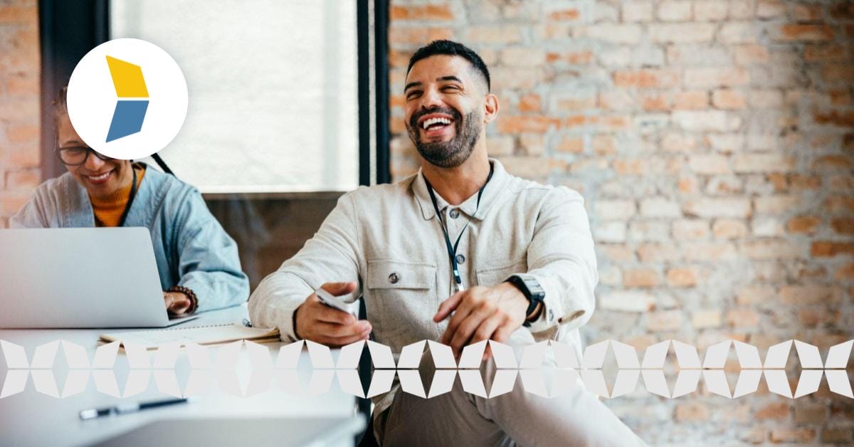 smiling relaxed business man sitting at a table with partner