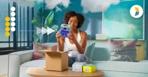 Woman unboxing Dropps laundry detergent, representing the importance of the unboxing experience in customer loyalty