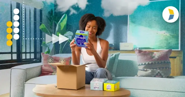 Woman unboxing Dropps laundry detergent, representing the importance of the unboxing experience in customer loyalty